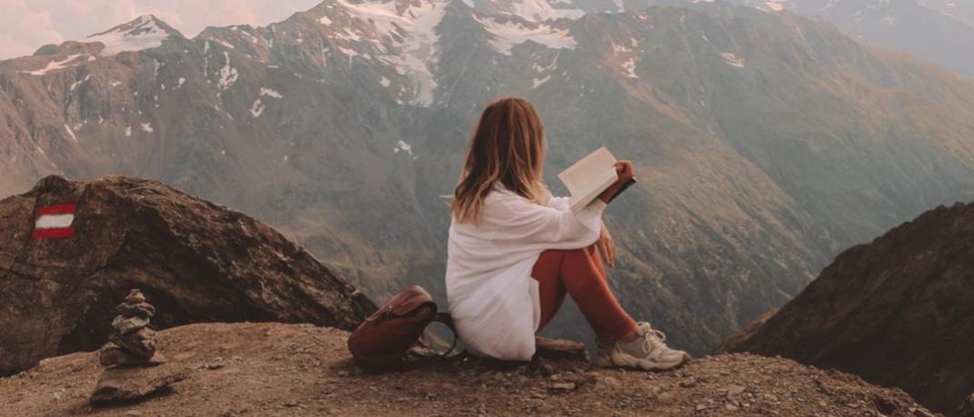 woman reading book mountain Autumn 