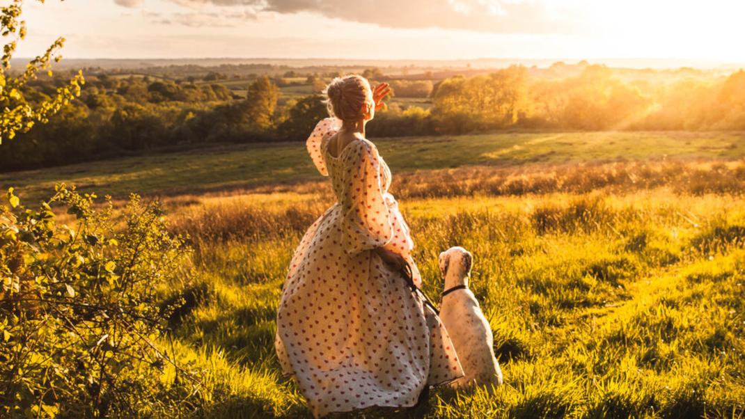 Woman in field with dog