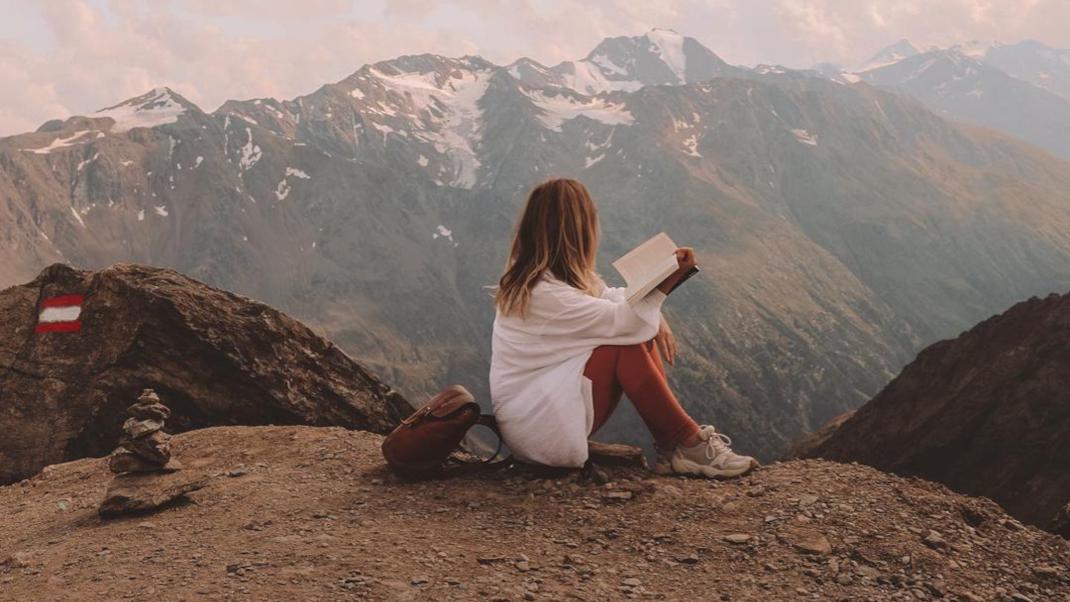 woman reading book mountain Autumn 