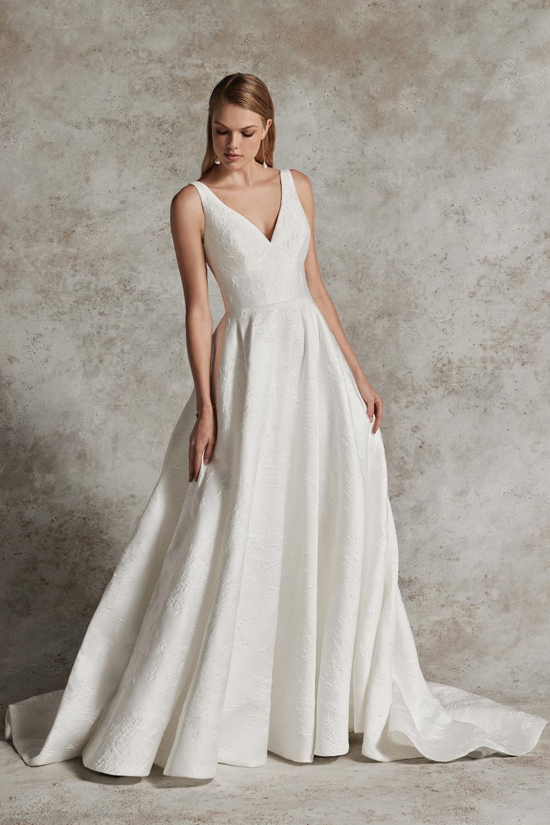 calypso : BROCADE BALL GOWN WITH MODEST V-NECKLINE AND KEYHOLE BACK