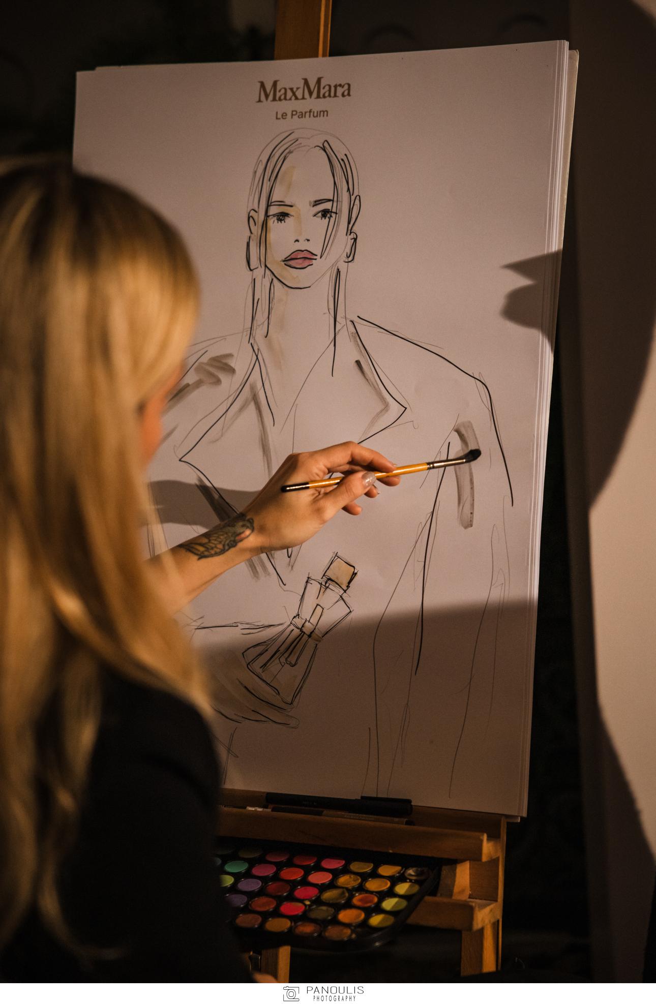 Η artist Παυλίνα Μπεχράκη δημιουργώντας τα μοναδικά πορτραίτα στις καλεσμένες