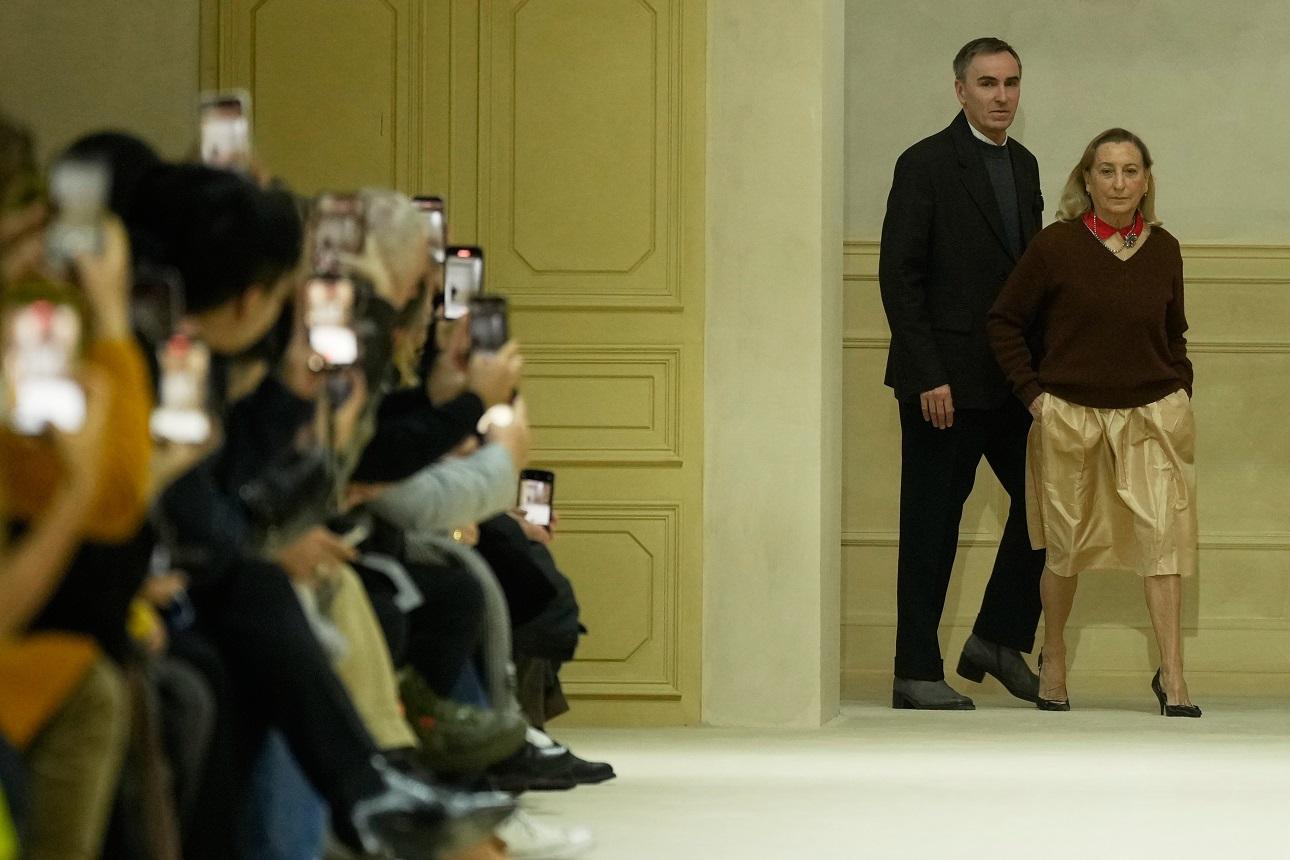 Miuccia Prada, Raf Simons/ AP Images