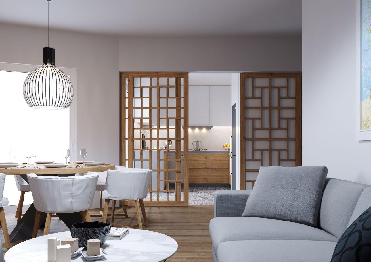 Το συρόμενο, διάτρητο διαχωριστικό από ξύλο επιτρέπει τη διακριτική οριοθέτηση της κουζίνας από το καθιστικό/ Φωτογραφία: Κυριακή Καπασακαλίδου 