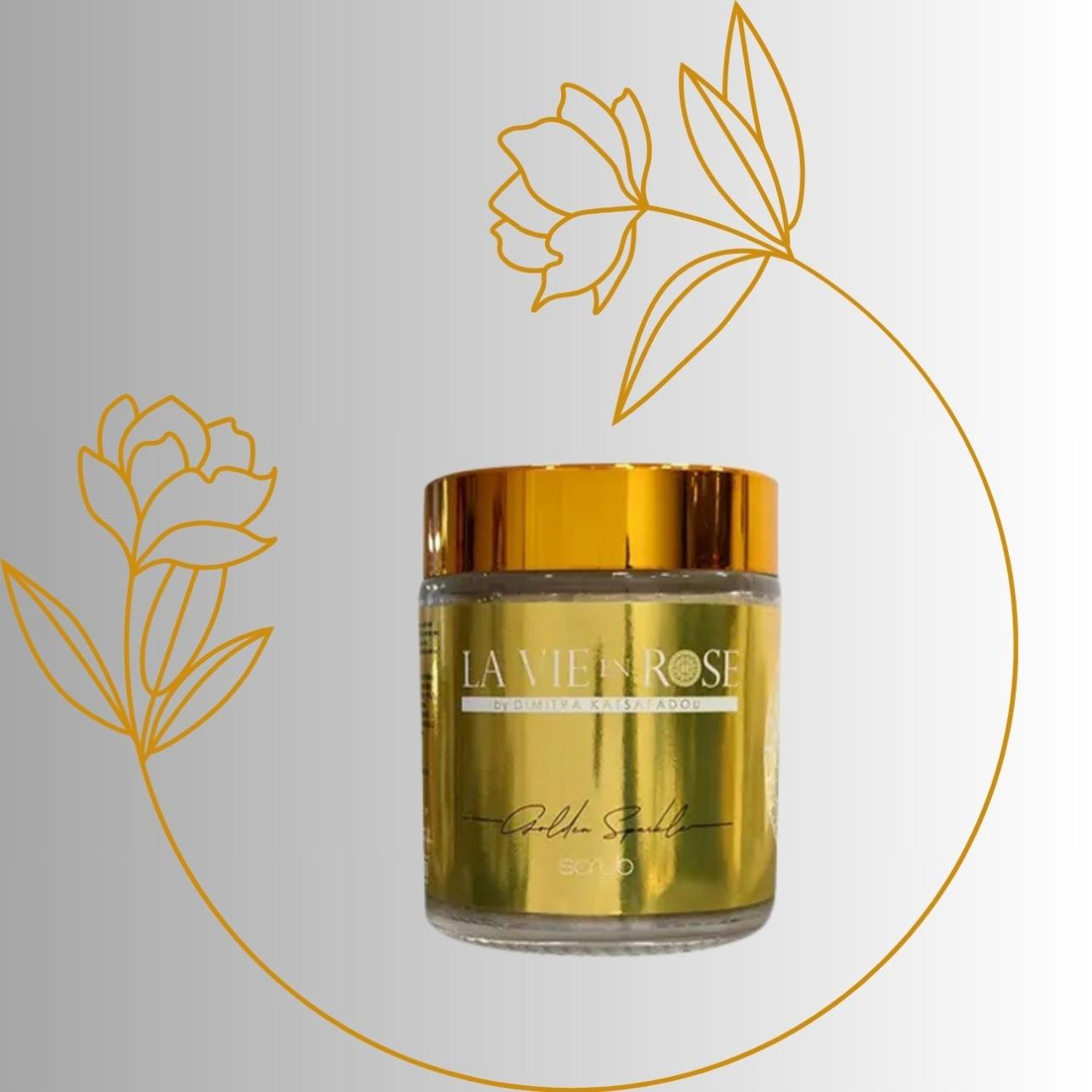Golden sparkle scrub, La Vie en Rose Κρεμώδες scrub προσώπου και σώματος με καστανή ζάχαρη, ενυδατικά βούτυρα και έλαια. Με θερμό άρωμα βανίλιας, ζεστές νότες κανέλας και δροσερή αίσθηση πορτοκαλιού που ταξιδεύουν τις αισθήσεις. Στη σύνθεση, η καστανή ζάχαρη απαλλάσσει το δέρμα από τα νεκρά κύτταρα, καθαρίζει σε βάθος του πόρους, απομακρύνει ρύπους και λιπαρότητα και αφήνει το δέρμα λείο και απαλό. Το βούτυρο καριτέ και το μελισσοκέρι, συμβάλλουν στη βαθιά ενυδάτωση, θρέψη, ελαστικότητα και λάμψη της επιδερμίδας. Τα αιθέρια έλαια δίνουν αντιοξειδωτική δράση και τονώνουν τις αισθήσεις.